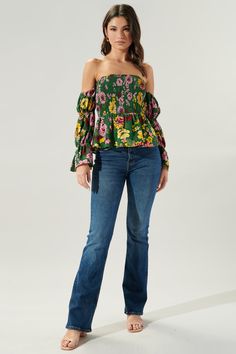 Autumn is in full bloom in the Everly Floral Off the Shoulder Smocked Peplum Top. Perfect for warmer autumn days, this top features a smocked bodice with a peplum waist. Smocked off the shoulder sleeves are attached. Complete the look with light wide leg pants and strappy heels for a flirty look.- Smocked bodice- Off the shoulder- Smocked sleeves- Peplum- Color: Green MultiSize + Fit - Model is 5'9" and wearing size XS- Measurements taken from size S - Chest: 29"- Length: 31 1/2" fabricSelf: 100 Bohemian Smock Peasant Top For Spring, Spring Bohemian Tops With Smocked Back, Bohemian Smocked Bodice Blouse For Fall, Bohemian Peasant Top With Smocked Cuffs For Fall, Bohemian Tops With Smocked Back For Spring, Bohemian Fall Blouse With Smocked Bodice, Bohemian Smock Tops For Fall, Fall Bohemian Smock Tops, Fall Peasant Tops For Casual Gatherings