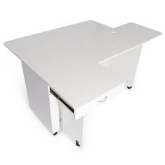 a white desk with an open drawer on the bottom and one section at the top