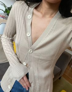 Elegant Fitted Ribbed Cardigan, Elegant Ribbed Spring Cardigan, Elegant Ribbed Spring Outerwear, Elegant Ribbed Outerwear For Spring, Elegant Ribbed Cardigan For Layering, Chic Fitted Ribbed Cardigan, Elegant Ribbed Button-up Cardigan, Fitted Fine Knit Button-up Sweater, Elegant Beige Ribbed Outerwear