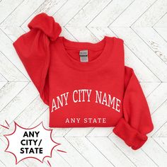 ◼️You can customize this shirt like: 👉🏻 ANY CITY NAME OR ANY WORD YOU WANT 👉🏻ANY STATE NAME OR PERSON NAME OR ANY WORD YOU WANT ◼️It is a Unisex Heavy Blen Crewneck Sweatshirt Gildan 18000 ● Made with a medium-heavy fabric blend of 50% cotton and 50% polyester (8.0 oz/yd² (271.25 g/m this sweatshirt feels cozy and is the perfect choice for those colder months. ● The classic fit along with the crew neckline deliver a comfy wearing experience with a clean-cut style. Meanwhile, the double-needl Casual T-shirt With Custom Text For College, Casual Custom Text T-shirt For Fall, Fall Casual T-shirt With Custom Text, Casual Fall T-shirt With Custom Text, Sporty Crew Neck Sweatshirt With Custom Text, Cotton Crew Top With Custom Text, School Spirit Cotton Sweatshirt With Name Print, Cotton Sweatshirt With Name Print For School Spirit, Casual Custom Text T-shirt For College