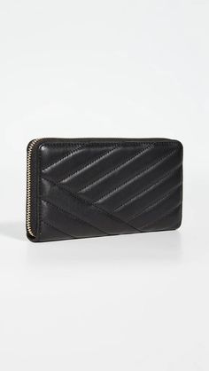 Add effortless style to your everyday with the luxurious Kira Chevron Zip Continental Wallet. Crafted from buttery soft lambskin leather with subtle quilting details, this durable yet stylish wallet features interior pockets and compartments to keep you organized on the go. Accented with signature gold-tone zipper and hardware, it carries all the essentials in one elegant package. At under 5 inches, its slim design fits discreetly in handbags without added bulk. Imported leather ensures quality Designer Evening Wallet With Zipper Closure, Modern Evening Wallet With Zipper Closure, Elegant Quilted Wallet For Formal Occasions, Elegant Quilted Rectangular Wallet, Elegant Quilted Wallets For Formal Occasions, Luxury Evening Wallet With Zipper Closure, Modern Leather Wallet With Zipper Closure, Elegant Quilted Leather Wallet, Classic Formal Quilted Wallet