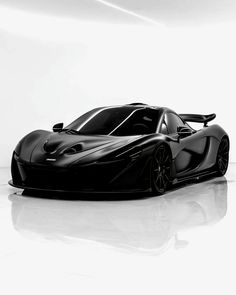 a black and white photo of a sports car