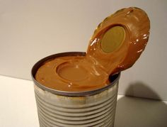 an open can of peanut butter on a table