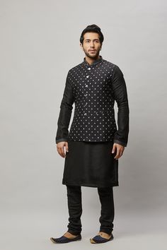 Cotton Linen blended kurta with contrast thread embroidered vest plus contrasting churidar. The cotton-linen blend makes it one of our lightest and most breathable kurtas. Crafted with a collar neckline, full sleeves, and front button closure. Occasion: Can be worn to events like Sangeet, Mehendi, & Wedding WASH CARE INSTRUCTIONS - Please Dry clean only when it is applicable. Slight color variation is possible due to digital photography. Cotton Nehru Jacket With Resham Embroidery, Sleeveless Cotton Kurta For Eid, Traditional Black Cotton Nehru Jacket, Transitional Cotton Nehru Jacket With Chikankari Embroidery, Fitted Cotton Nehru Jacket For Festivals, Transitional Sleeveless Cotton Kurta, Cotton Nehru Jacket Straight Kurta For Festivals, Cotton Nehru Jacket For Festivals, Sleeveless Cotton Kurta