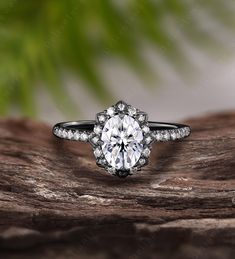 a diamond ring on top of a piece of wood