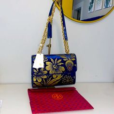 New Tory Burch Fleming Large Size Convertible Shoulder Bag In Velvet Cosmic Floral. Comes With Tory Burch Gift Bag. Removable Tassel. Can Be Converted To Double Strap Shoulder Bag Or Single Strap Crossbody. Has Tag, Still Plastic Wrapped On Magnetic Snap Closure, Tassel, Internal “Tory Burch Logo” And Zipper Pulls. Fold Over Snap Magnet Flap Closure. 3 Internal Pockets: 1 Zippered, 2 Open. 1 Back External Pocket. Combination Velvet And Patent Leather. Blue Patent Leather, Embossed Velvet Flower Blue Flap Bag With Gold-tone Hardware, Blue Crossbody Flap Bag With Gold-tone Hardware, Blue Flap Bag With Dust Bag, Designer Blue Flap Bag With Removable Pouch, Embossed Velvet, Tory Burch Crossbody Bag, Tory Burch Kira Chevron, Black Fanny Pack, Velvet Flower