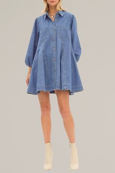 introducing our button up denim dress, a timeless addition to your wardrobe. made with durable denim material and featuring a collared neckline, this dress exudes a classic and timeless look. its practical pockets and elasticized cuffs make it both stylish and functional. perfect for any occasion. 100% cotton model is wearing a size small model is 5'10" Relaxed Fit Chambray Dress With Pockets, Dark Wash Chambray Dress With Pockets, Denim Blue Cotton Button-up Dress, Button-up Denim Blue Cotton Dress, Spring Medium Wash Shirt Dress With Button Closure, Medium Wash Button Closure Shirt Dress For Spring, Collared Fitted Denim Dress, Light Wash Collared Dress With Pockets, Denim Blue Collared Cotton Shirt Dress