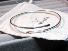 Personalised bangle wrap bangle hammered bangle initial bangle initial bracelet custom bangle hand stamped bangle hand stamped bracelet cuff bracelet bangle bracelet silver bangle bracelet gifts for her adjustable bangle 925 sterling silver custom bangle with words, mother's day gift mothers day bracelet, mothers day jewellery. MATERIAL Round 925 sterling silver bangle (open), 1.8 mm in diameter. SIZE Small size: 2.25 inches in diameter Medium size: 2.5 inches in diameter Large size: 2.75 inches in diameter The bracelet is adjustable. PERSONALIZED INITIAL OR NUMBER Personalise it on either or both edges of the bangle with initials/ numbers (maximum of 3 characters each) HOW TO PERSONALISE 1. Select the initial position. 2. Select the size. 3. Write down the initials in the personalisation Mothers Day Jewellery, Silver Initial Bracelet, Initial Bracelet Silver, Custom Bangle, Personalised Bangle, Handstamped Bracelet, Hammered Bangles, Wrap Bangles, 3 Characters