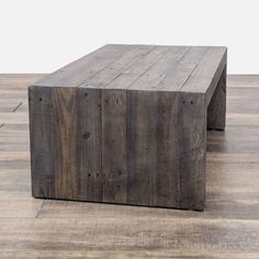 a wooden table sitting on top of a hard wood floor