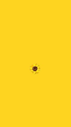 a yellow background with a black dot in the center