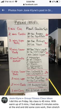 a white board with red writing on it in a gym area next to other equipment