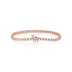 Inspired by the fire and radiance of our superlative diamonds, Tiffany Victoria uses a unique combination of cuts for a distinctly romantic sensibility. This feminine take on the classic line bracelet features a dazzling clasp of marquise diamonds. 18k rose gold with diamonds; 6.75" long; Marquise diamonds, carat total weight .18; Round brilliant diamonds, carat total weight 2.90 | Tiffany Victoria® Tennis Bracelet in Rose Gold with Diamonds Quince Planner, Tiffany Victoria, Classic Diamond Earrings, Tiffany Bracelets, Bracelets Charm, Stackable Bangles, Cluster Bracelets, Wrist Jewelry, International Jewelry