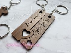 two wooden keychains that have been engraved with the words love and coffee on them