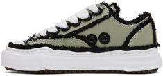 Low-top canvas sneakers in khaki. Frayed detailing in black throughout. · Rubber cap toe in white · Lace-up closure · Logo patch at tongue · Eyelet vents at inner side · Canvas lining · Sculptural foam rubber midsole in white · Treaded rubber outsole Supplier color: Khaki