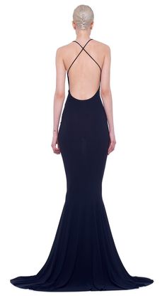 the back of a woman wearing a black evening gown