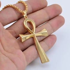 Adorn yourself with the timeless symbol of life and prosperity - our Zinc Alloy Big Ankh Cross Necklace. Crafted with intricate detail and durability in mind, this necklace features a bold representation of the iconic Ankh Cross, a revered emblem from ancient Egypt. The zinc alloy construction ensures both sturdiness and style, allowing you to wear this piece as a striking tribute to the rich heritage and mystique of Egypt. Metals Type: Zinc alloy Chain Type: O-chain We ship worldwide to 185 cou Egypt Necklace, Metal Symbol, Cross Necklace Gold, Egyptian Ankh, Ankh Necklace, Ankh Cross, Symbol Of Life, Crucifix Necklace, Outfits Jewelry