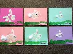 four different colored cards with white and pink rabbits on them, one is for easter