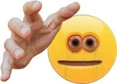 a hand is reaching out towards an emoticive smiley face