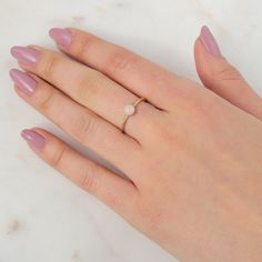 Our delicate Rose Quartz Ring features a pink natural gemstone in a gold filler or sterling silver setting! Rose Quartz is the birthstone for all our October-born babes. Don't know your ring size? Ring Size Guide or Buy Ring Sizer …………………………………. Details: Stone is Natural Rose Quartz, measuring 5mm Available in 14k Gold Filled or Sterling Silver Waterproof and can be worn everyday Size Inclusive and made to order About Your Jewelry If you are not wearing your jewelry it is best to store it in a c Dainty Pearl Promise Ring With Birthstone, Dainty Pearl Birthstone Promise Ring, Adjustable Opal Birthstone Ring For Everyday, Minimalist Adjustable Rose Gold Crystal Ring, Adjustable Minimalist Rose Gold Crystal Ring, Everyday Rose Gold Gemstone Rings, Dainty Rose Gold Stackable Crystal Ring, Rose Gold Rings With Rose Quartz For Gifts, Tiny Rose Gold Stackable Rings