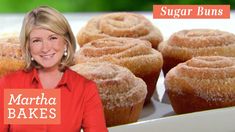 a woman standing in front of a tray of sugar buns with the words martha bakes on it