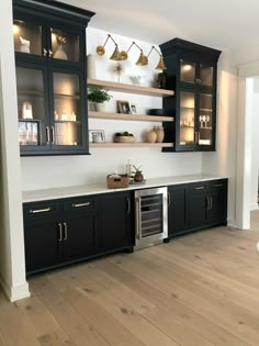 Cabinets are Tricorn Black by Sherwin Williams Wine Bar Room Ideas, Black Bar Area In Home, Dry Bar Black Cabinets, Black Kitchenette Cabinets, Wine Cabinets In Kitchen, Black Cabinet Bar Ideas, Built In Bar Cabinets For Home, Black Wet Bar Cabinets, Built In Shelves Bar