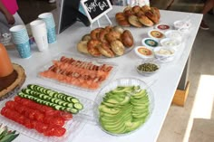 there are many different types of food on the table, including cucumbers and tomatoes