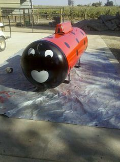 an inflatable fire hydrant sitting on top of a tarp covered ground