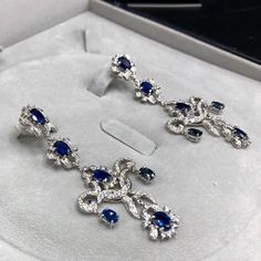 ENJOY OUR WORRY-FREE SERVICE AND THE DAZZLING, GENUINE JEWELRY WE DESIGN AND HANDCRAFT WITH LOVE❤️ ABOUT THE ITEM: A true MASTERPIECE, CHANDELIER EARRINGS, FEATURING 12 PIECES OF TOP GRADE, VIVID BLUE, FULLY TRANSPARENT, SIAMESE BLUE SAPPHIRES, weighting a total of 10.42 carats & over 232 pieces of E/VS DIAMONDS. With total diamonds weight at a WHOOPING 2.61 carats!! Set in ONE OF A KIND 18K SOLID WHITE GOLD, ENORMOUS CHANDELIER EARRINGS! (18 grams of gold weight) WORLD-CLASS MASTERPIECE NOW Luxury Oval Sapphire Diamond Earrings, Luxury Sapphire Diamond Earrings, Luxury Sapphire Diamond Earrings With Brilliant Cut, Luxury Platinum Blue Earrings, Luxury Sapphire Earrings, Luxury Blue Platinum Earrings, Luxury White Gold Sapphire Diamond Earrings, Luxury Blue Diamond Earrings, Luxury Sapphire Earrings With Brilliant Cut