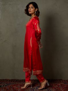 Editor's Note Elevate your ethnic look with our red ari-hand embroidered girija kurta, paired with churidar and a coordinating dupatta. This ensemble combines traditional charm with intricate hand embroidery, perfect for special occasions and celebrations. Fabric: Silk satin Color: Red Components: Kurta, churidar and dupatta Occasion: Festive Note: Product colour may slightly vary due to photographic lighting sources Care: Dry clean only About the DesignerRi Ritu Kumar is one of India’s foremost Festive Slub Silk Kurta With Embroidered Border, Cotton Silk Palazzo Set With Embroidered Border For Diwali, Diwali Slub Silk Kurta With Embroidered Border, Diwali Cotton Silk Palazzo Set With Embroidered Border, Wedding Anarkali Set With Embroidered Border In Slub Silk, Traditional Slub Silk Churidar With Embroidered Border, Diwali Slub Silk Anarkali Set With Embroidered Border, Diwali Cotton Silk Sharara With Embroidered Border, Designer Cotton Silk Churidar With Embroidered Border