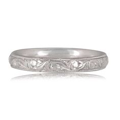 an engraved wedding band in white gold