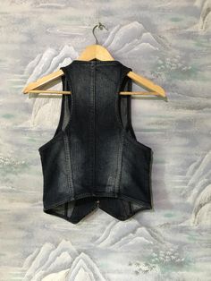 "Vintage Extra Small Size Vest Denim Vest Women Jeans Vest Blue Denim Vest Fitted Waistcoat Jeans Waistcoat Extra Small to Small Waistcoat Label size: 34 Estimated size: XS/S Measurements (lying flat): Length: 19,2\" - 49 cm Pit to pit: 14,5\" - 37 cm Waist: 13,7\" - 35 cm Please check measurements to insure a proper fit. Remember to allow yourself some extra room for movement. You can compare these with something from your closet that fits you well. This vest will come to you freshly laundered Medium Wash Denim Vest Top For Fall, Fall Medium Wash Denim Vest Top, Trendy Denim Vest Top For Fall, Trendy Fall Denim Vest Top, Denim Blue Denim Vest Outerwear, Trendy Denim Blue Vest Outerwear, Dark Wash Denim Top For Winter, Winter Dark Wash Denim Top, Trendy Denim Vest Outerwear