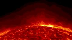 the sun as seen from space with bright red and yellow light shining on it's surface