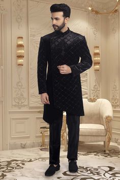 This black sherwani is adorned with delicate cutdana and shimmering sequins, making it an exquisite choice for sangeet ceremonies or reception nights. The perfect choice for any wedding, this sophisticated piece will have you looking and feeling your best. Formal Sherwani With Mirror Work For Diwali, Formal Sherwani With Mirror Work For Transitional Season, Festive Formal Sherwani With Mirror Work, Formal Transitional Kurta With Mirror Work, Formal Transitional Sherwani With Mirror Work, Transitional Formal Kurta With Mirror Work, Eid Formal Traditional Wear With Mirror Work, Formal Traditional Wear With Mirror Work For Eid, Elegant Nehru Jacket With Mirror Work For Transitional Season