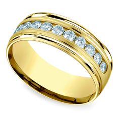 a yellow gold wedding ring with white diamonds