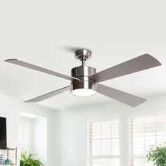 a modern ceiling fan in a white room