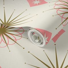 a wallpaper with pink and gold designs on it's sides, including a roll of tape