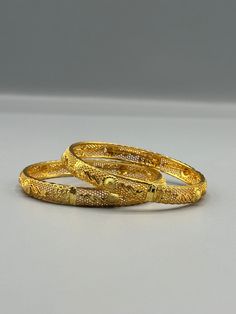 Our 24k Polished Bangles are more than just accessories; they are symbols of grace and beauty, inspired by the rich heritage of Indian, Pakistani, and Nepali jewelry. These stunning bangles showcase the timeless elegance of traditional craftsmanship, perfectly complementing your attire for weddings, festivals, or any special occasion Our company offers expedited Next-Day Delivery Services within the United Kingdom, ensuring prompt and efficient transportation of goods.  Additionally, we strive to extend our shipping capabilities to cater to customers worldwide, aiming to provide the fastest possible shipping methods to international destinations. To ensure the highest standards of hygiene, we kindly request your understanding that all sales are final, and we are unable to accept returns or Nepali Jewelry, Grace Symbol, Gold Plated Bangles, Wedding Attire, Timeless Elegance, Bangle Bracelets, United Kingdom, Special Occasion, Jewelry Bracelets