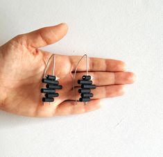 Contemporary earrings made of stainless steel earring hooks, black rubber and pearl bead. Stainless steel is 100% hypoallergenic and will not produce skin irritation or discoloration. Length: 6 cm / 2.4 in Package will be shipped out as soon as I possibly can which is usually 3 - 5 days after the purchase. Don't hesitate to contact me if you have any question. Thanks for stopping by and don't forget to check my other items. Join Pevalek Jewellery at https://www.facebook.com/PevalekJewellery Modern Handmade Black Hoop Earrings, Modern Black Handmade Hoop Earrings, Modern Black Hypoallergenic Jewelry, Modern Black Jewelry With Ear Wire, Minimalist Handmade Black Earrings, Black Minimalist Metal Earrings, Black Minimalist Ear Wire Earrings, Minimalist Black Earrings With Ear Wire, Minimalist Black Linear Earrings As Gift