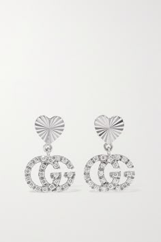 Gucci's earrings have been made in Italy from 18-karat white gold - the archival 'GG' moniker honors label founder Guccio Gucci. Dangling from heart-shaped posts with an etched sunburst, they're dusted with glinting diamonds. The petite drops move prettily as you do. Mens Wedding Bands Silver, Cartier Bracelet Stack, Men Gold Jewelry, Gucci Sneakers Outfit, Oval Wedding Ring Set, Rings For Men Gold, Bracelet Stack Ideas, Wedding Bands Silver, Van Cleef Bracelet