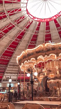 the inside of a carousel with lights on it