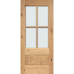 a wooden door with glass panels on the front and side paneled in light wood