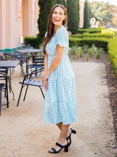 Introducing our versatile Tiered Gingham Dress! Whether you're headed to the office or a dinner date, this dress has got you covered. With its flattering tiered design, this dress exudes a playful yet chic vibe that's perfect for any occasion. Made with high-quality materials, this dress is both comfortable and durable, ensuring that you'll be able to wear it again and again. The classic gingham pattern adds a touch of vintage charm that's sure to turn heads wherever you go. Available in sizes s Red Gingham Dress, Maxi Skirt Dress, Gingham Pattern, Aqua Dress, Red Gingham, Dress Xl, Dinner Date, Gingham Dress, Knee Length Dresses