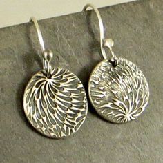 These petite fine silver textured earrings are so fun! The silver discs go through a process of rolling a texture from precious metal clay, sanding, filing, firing in a kiln, oxidation and then more polishing. The end product is 99.9% pure (fine) silver. The diameter of the discs is 5/8 inch and the length of the earrings from top of ear wire to bottom of disc is just a tad over 1.25 inches. Torch balled ear wires are hand formed from sterling silver. Please contact me with any questions. Thank Everyday Nickel-free Round Pendant Earrings, Adjustable Nickel-free Pendant Earrings, Artistic Teardrop Sterling Silver Jewelry, Artistic Sterling Silver Teardrop Earrings, Artistic Sterling Silver Teardrop Jewelry, Sterling Silver Round Pendant Earrings, Unique Nickel-free Earrings For Anniversary, Unique Nickel-free Round Earrings, Cadmium-free Silver Round Earrings