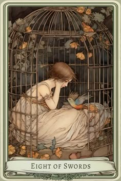 a woman sitting in a bird cage next to a bird