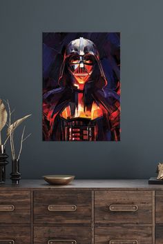 a star wars poster hanging on the wall next to a dresser with drawers and vases