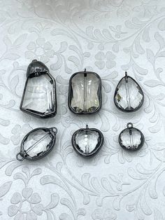 Crystal Gunmetal Soldered Pendants and charms. Connector Soldered Charm, 6 Styles of Charms and Pendants, Clear Crystal. Fast Shipping 6 Shapes/ styles (Choose from menu) Size: Style #1: 44.7mm x 23.8mm Style #2: 32.2mm x 21.7mm Style #3: 28.5mm x 19mm Style #4: 30.3mm x 18.7mm Style #5: 22mm x 20mm Style #6: 18.5mm x 15.7mm Gunmetal Components used in finished pieces are not included but can be purchased in my shop. For ideas only. www.instagram.com/blingbya @blingbya Stamped Solder Jewelry, Soldered Pendants, Clear Crystal Necklace, Cheese Danish, Stained Glass Jewelry, Soldering Jewelry, Clear Crystals, Crystal Necklace Pendant, Shipping Orders