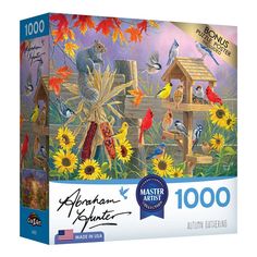 the puzzle box is full of birds and flowers, including one birdhouse with sunflowers on it