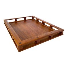 a wooden tray with two handles on each side