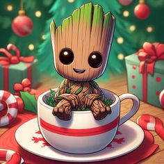 a baby groote sitting in a cup with christmas decorations around it