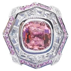 Pink Tourmaline 6.30 carats, Pink Sapphire 0.99 carat, White Topaz 30.98 carats and Diamond 0.21 carat Ring set in 18K White Gold Settings Width: 2.7 cm Length: 2.7 cm Ring Size: 52 Total Weight: 27.37 grams "We first opened doors in 1980 when it was then situated in the vicinity of the Victory Monument; a small and modest storefront with a couple of counters. From its humble beginnings to where it stands today, our company has proven its abilities as a jeweler. Since the beginning, we have been supplying fine quality pieces to dealers, wholesalers and customers worldwide. From then till now, our business still interrelates its name with quality products and excellent service, where commitment and sincerity toward customers will always be its motto." White Topaz, Pink Tourmaline, Pink Sapphire, Cocktail Rings, Earings Piercings, Ring Sets, Tourmaline, Topaz, Monument